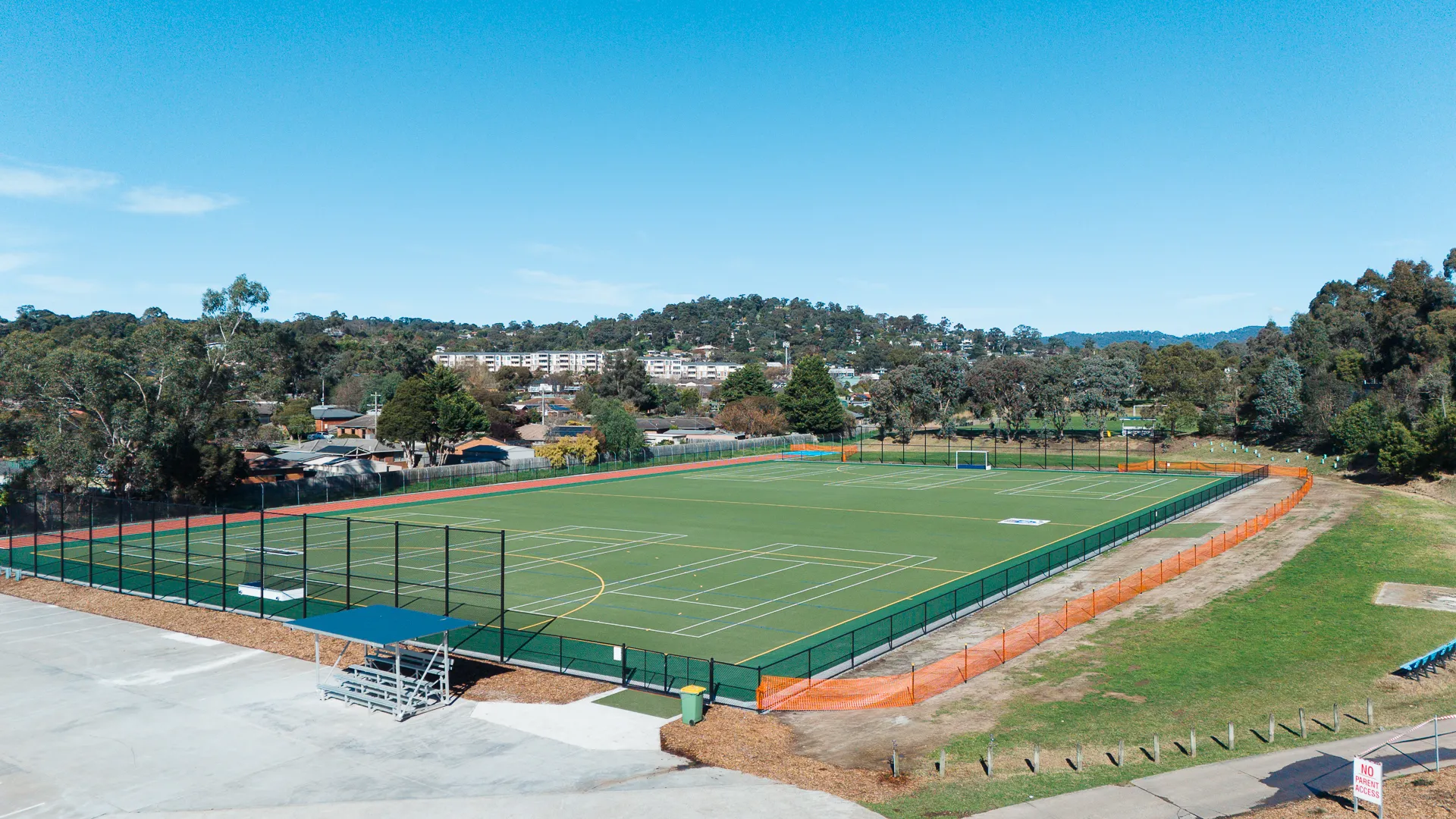 Aerial view of outdoor sports field and surrounding area.